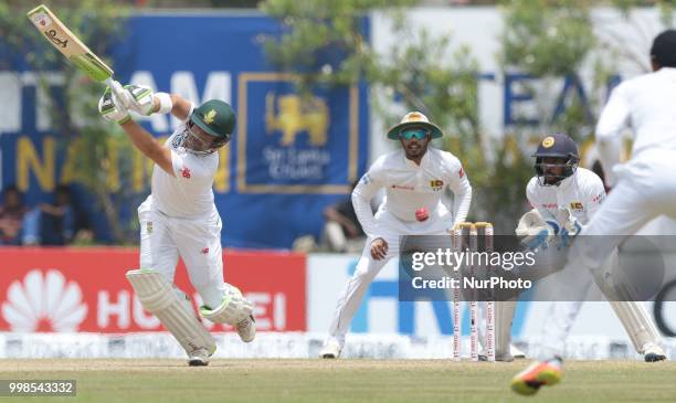 South African cricketer Dean Elgar misses the ball and gets stumed by Sri Lankan wicketkeeper Niroshan Dickwella during the 3rd day's play in the...