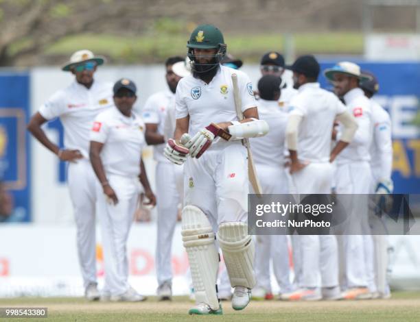South Africa's Hashim Amla leaves following dismissal during the 3rd day's play in the first Test cricket match between Sri Lanka and South Africa at...