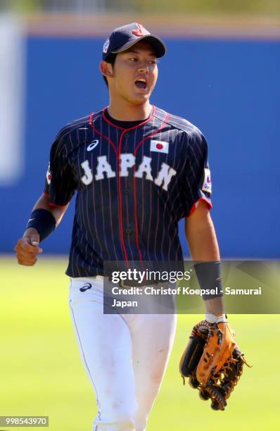 Toshiya Sato of Japan rictus in the first inning during the Haarlem Baseball Week game between Chinese Taipei and Japan at the Pim Mulier...