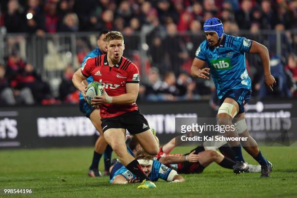 Jack Goodhue of the Crusaders charges forward during the round 19 Super Rugby match between the Crusaders and the Blues at AMI Stadium on July 14,...