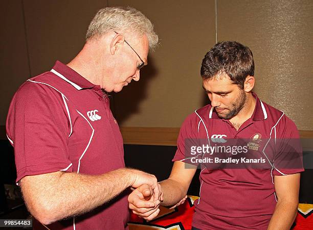 Cameron Smith is checked by the team doctor at the media call following the Queensland Maroons State of Origin I team announcement at the Sofitel...