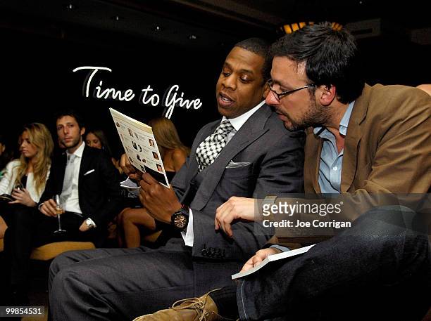 Rapper/businessman Jay-Z discusses with his guest the watches that are featured in the Audemars Piguet and the Tony Awards' "Time To Give" auction at...