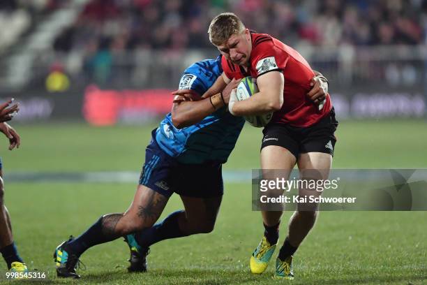 Jack Goodhue of the Crusaders charges forward during the round 19 Super Rugby match between the Crusaders and the Blues at AMI Stadium on July 14,...
