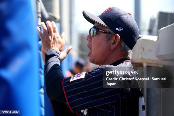 Manager Tsutomu Ikuta of Japan applauds his team during the Haarlem Baseball Week game between Chinese Taipei and Japan at the Pim Mulier...