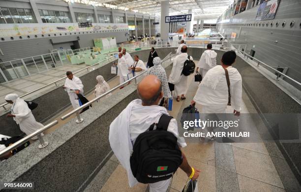 Bangladeshi Muslim pilgrims arrive at Jeddah airport on July 14 prior to the start of the annual Hajj pilgrimage in the holy city of Mecca. - The...