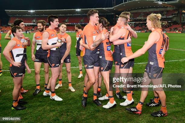 Giants players celebrate victory during the round 17 AFL match between the Greater Western Sydney Giants and the Richmond Tigers at Spotless Stadium...
