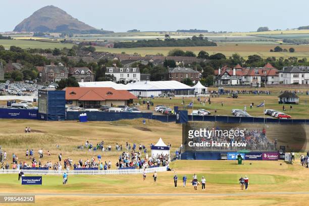 Justin Rose of England and Hideto Tanihara of Japan walk from the tee on hole one during day three of the Aberdeen Standard Investments Scottish Open...