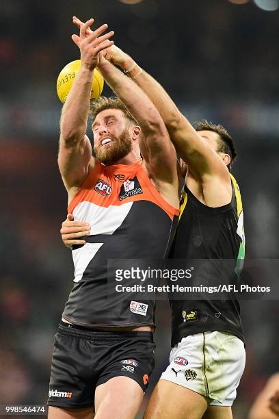 Dawson Simpson of the Giants and Toby Nankervis of the Tigers contest the ball during the round 17 AFL match between the Greater Western Sydney...
