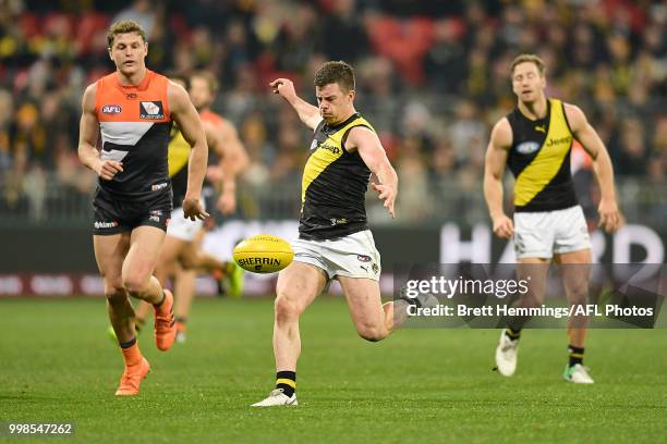 Jack Higgins of the Tigers runs with the ball during the round 17 AFL match between the Greater Western Sydney Giants and the Richmond Tigers at...