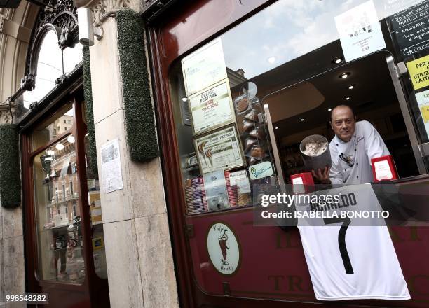 Mister Leonardo, from Miretti's ice-cream shop in downtown Turin, poses with the new ice-cream taste called CR7 and created for Cristiano Ronaldo's...