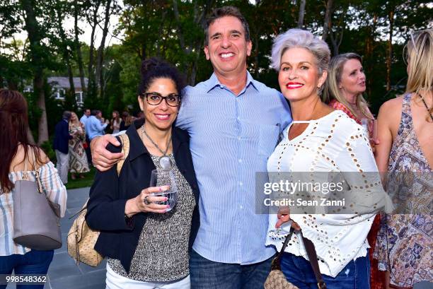 Paula Corsair, Frank Tricoluzzi and Laura McKinnon attend AVENUE on the Beach Invites You To Celebrate Our July Issue at Mecox Barn on July 13, 2018...