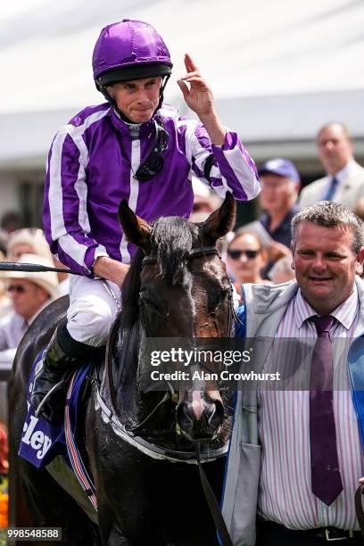 Ryan Moore riding US Navy Flag return after winning The Darley July Cup at Newmarket Racecourse on July 14, 2018 in Newmarket, United Kingdom.