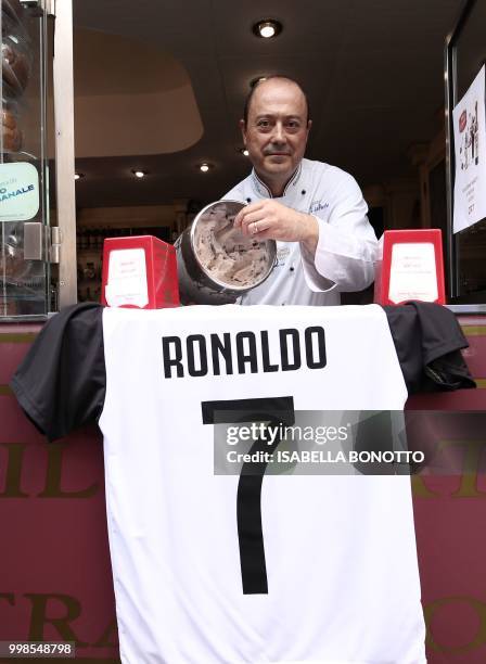 Mister Leonardo, from Miretti's ice-cream shop in downtown Turin, poses with the new ice-cream taste called CR7 and created for Cristiano Ronaldo's...