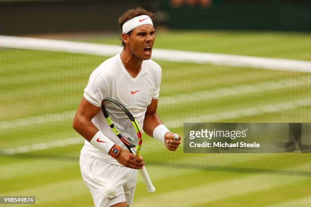 Rafael Nadal of Spain celebrates a point against Novak Djokovic of Serbia during their Men's Singles semi-final match on day twelve of the Wimbledon...