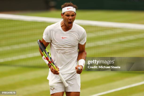 Rafael Nadal of Spain celebrates a point against Novak Djokovic of Serbia during their Men's Singles semi-final match on day twelve of the Wimbledon...