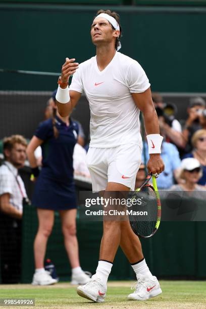 Rafael Nadal of Spain appears dejected during his Men's Singles semi-final match against Novak Djokovic of Serbia on day twelve of the Wimbledon Lawn...