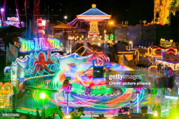 July 2018, Germany, Duesseldorf: The "Big Monster" carousel at the Rheinkirmes is shaped like an octopus. The Rheinkirmes in Duesseldorf is taking...