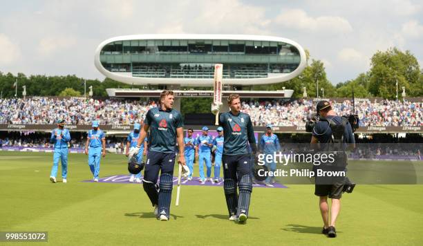 Joe Root of England leaves the field with David Willey after scoring 113 runs during the 2nd Royal London One-Day International between England and...
