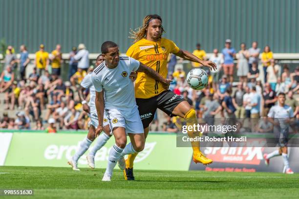 Helder Costa of Wolverhampton Wanderers vies with Kevin Mbabu of BSC Young Boys during the Uhrencup 2018 on July 14, 2018 at the Neufeld stadium in...