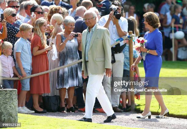 King Carl Gustaf of Sweden and Queen Silvia of Sweden meet wellwishers during the occasion of The Crown Princess Victoria of Sweden's 41st birthday...