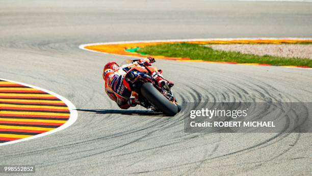 Repsol Honda Team's Spanish rider Marc Marquez competes to place first in the qualifying of the Moto GP for the Grand Prix of Germany at the...