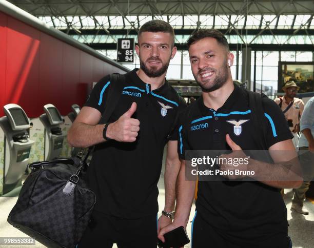 Valon Berisha and Riza Durmisi of SS Lazio departs for pre-season training camp on July 14, 2018 in Rome, Italy.