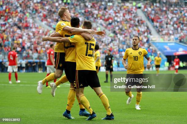 Thomas Meunier of Belgium celebrates with team mates Nacer Chadli and Kevin De Bruyne after scoring his team's first goal during the 2018 FIFA World...