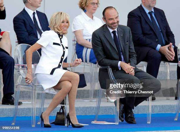 Wife of French President, Brigitte Macron and French Prime minister Edouard Philippe attend the traditional Bastille Day military parade on the...