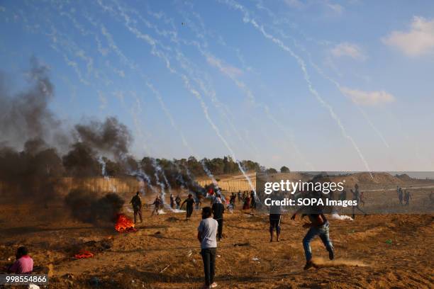 Tear gas canisters hit Palestinian civilians. Clashes between Palestinian citizens and the Israeli forces on the borders of the Gaza Strip east of...