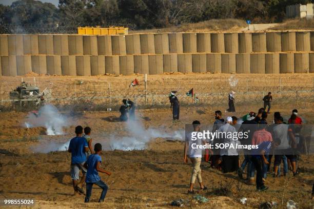 Tear gas canisters hit Palestinian civilians. Clashes between Palestinian citizens and the Israeli forces on the borders of the Gaza Strip east of...