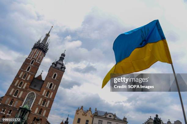 Ukrainian flag is seen during the protest. Protest demanding the release of the Ukrainian filmmaker and writer, Oleg Sentsov at the Main Square in...