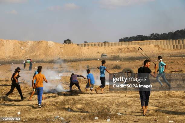 Tear gas canisters hit Palestinian civilians. Clashes between Palestinian citizens and the Israeli forces on the borders of the Gaza Strip east of...