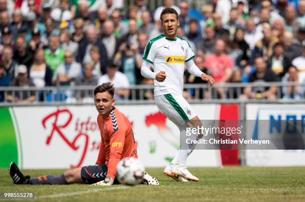 Fabian Johnson of Borussia Moenchengladbach scores his team first goal during the preseason friendly match between SC Weiche Flensburg and Borussia...