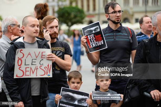 People seen holding posters during the protest. Protest demanding the release of the Ukrainian filmmaker and writer, Oleg Sentsov at the Main Square...