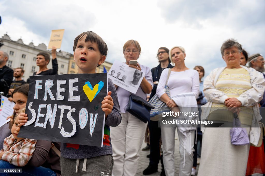 A child holds a banner saying Free Oleg Sentsov during the...