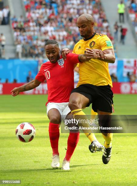 Raheem Sterling of England is challenged by Vincent Kompany of Belgium during the 2018 FIFA World Cup Russia 3rd Place Playoff match between Belgium...