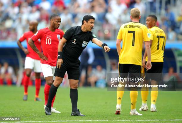 Referee Alireza Faghani talks to Kevin De Bruyne of Belgium during the 2018 FIFA World Cup Russia 3rd Place Playoff match between Belgium and England...