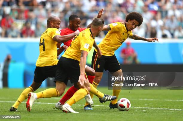Raheem Sterling of England is chellenged by Vincent Kompany, Axel Witsel and Toby Alderweireld of Belgium during the 2018 FIFA World Cup Russia 3rd...