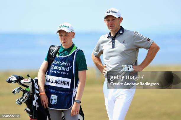 Stephen Gallacher of Scotland looks on with his caddy, Jack Gallacher during day three of the Aberdeen Standard Investments Scottish Open at Gullane...