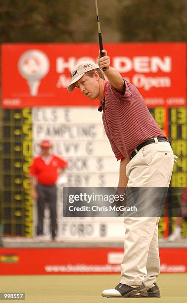 Scott Laycock of Australia wills his putt into the hole on the 16th green during the second round of the Holden Australian Open Golf Tournament held...