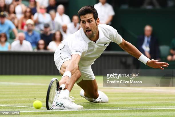 Novak Djokovic of Serbia fails to return against Rafael Nadal of Spain during their Men's Singles semi-final match on day twelve of the Wimbledon...