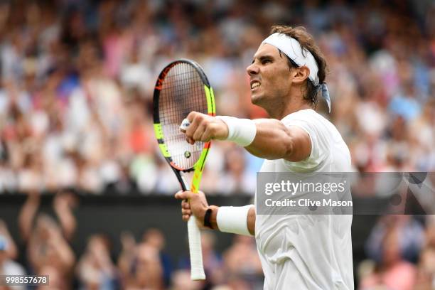 Rafael Nadal of Spain celebrates a point against Novak Djokovic of Serbia during their Men's Singles semi-final match on day twelve of the Wimbledon...