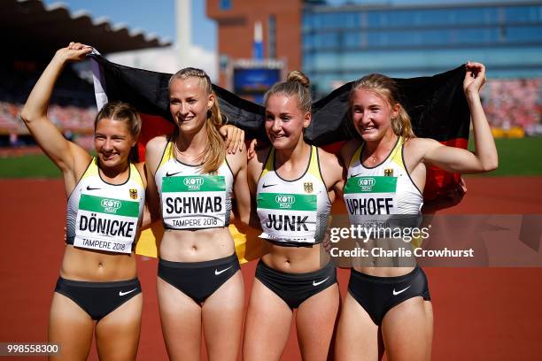 Denise Uphoff, Sophia Junk, Victoria Donicke and Corinna Schwab of Germany celebrate after winning gold in the final of the women's 4x100m on day...