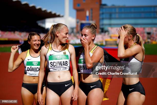 Denise Uphoff, Sophia Junk, Victoria Donicke and Corinna Schwab of Germany celebrate after winning gold in the final of the women's 4x100m on day...