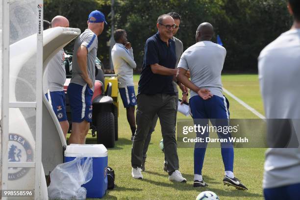 Maurizio Sarri of Chelsea meets Eddie Newton during a training session at Chelsea Training Ground on July 14, 2018 in Cobham, England.