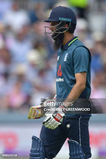 England's Moeen Ali leaves the crease after losing his wicket during the second One Day International cricket match between England and India, at...