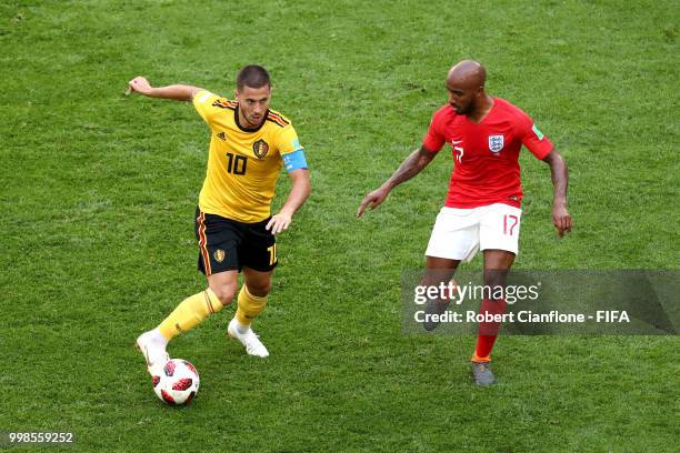 Eden Hazard of Belgium challenge for the ball with Fabian Delph of England during the 2018 FIFA World Cup Russia 3rd Place Playoff match between...