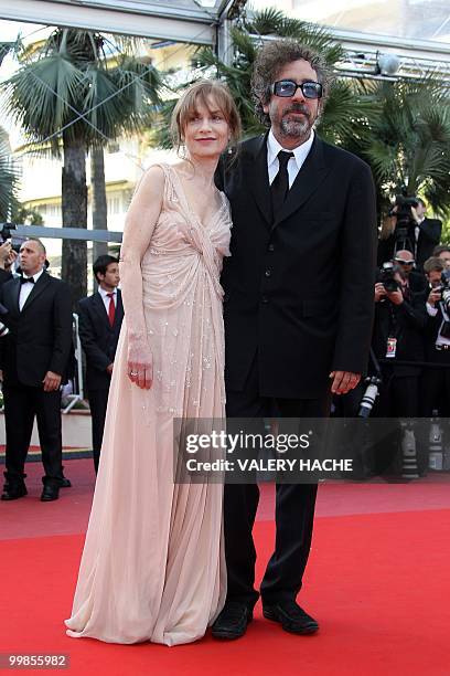 Director and president of the jury Tim Burton and French actress Isabelle Huppert arrive for the screening of "Biutiful" presented in competition at...