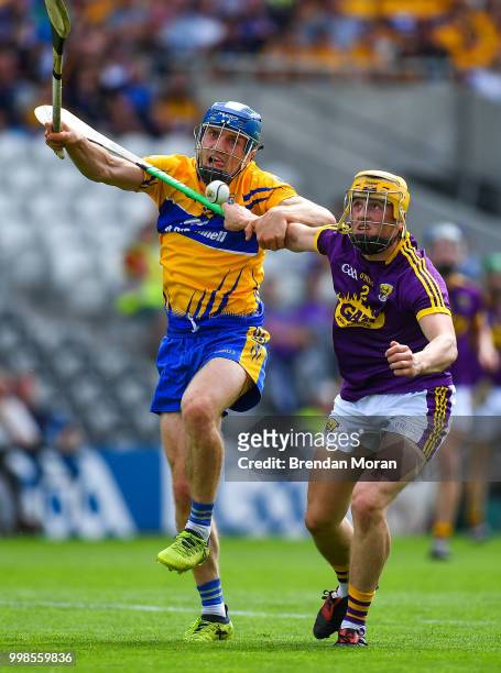 Cork , Ireland - 14 July 2018; Shane O'Donnell of Clare in action against Damien Reck of Wexford during the GAA Hurling All-Ireland Senior...