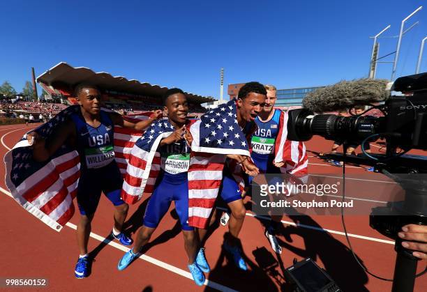 Eric Harrison, Anthony Schwartz, Austin Kratz and Micah Williams of The USA celebrate winning gold in the final of the men's 4x100m relay on day five...